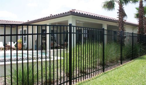 Black aluminum fence around a home