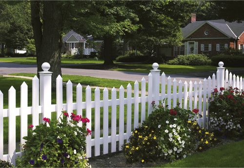 A beautiful garden surrounded by vinyl fence