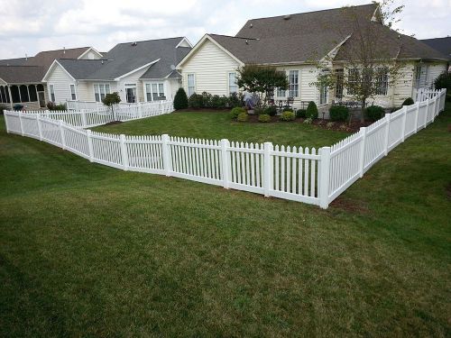 Vinyl fence surrounds a residential property