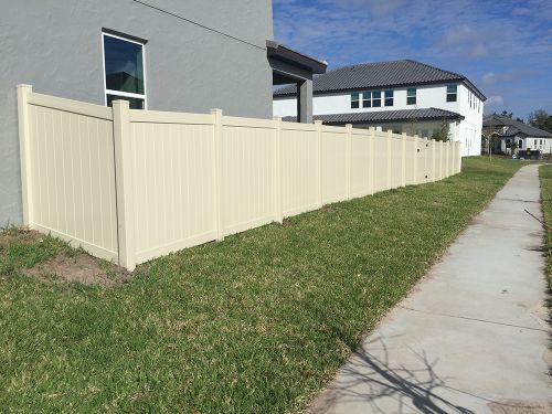 Beige privacy vinyl fence