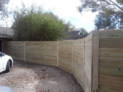 Curved horizontal wood fence