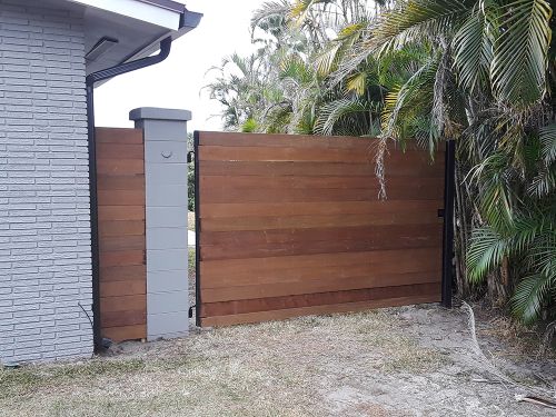 Wood fence and gate attached to cement post