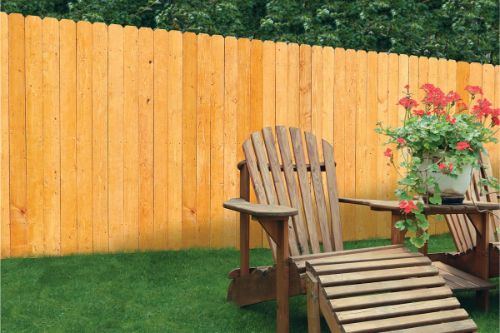 Wood fence behind a wood lounge chair