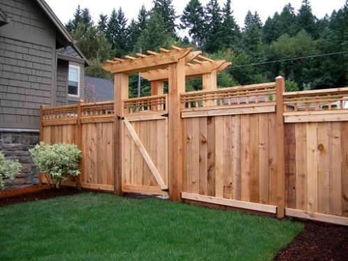 Wood fence with a custom arch top gate