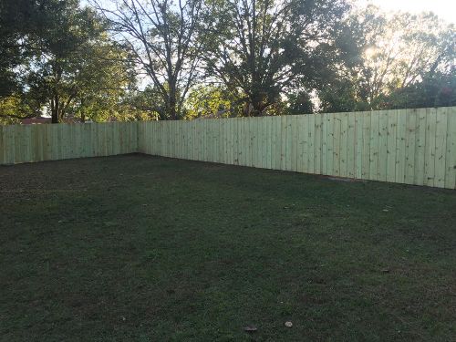 Wood fence around a large yard